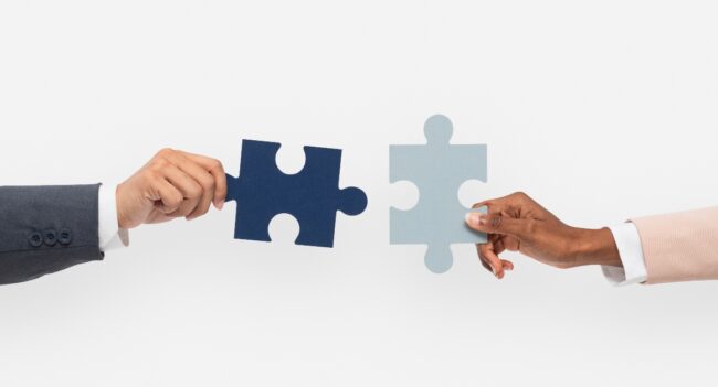 Hands holding puzzle business problem solving concept